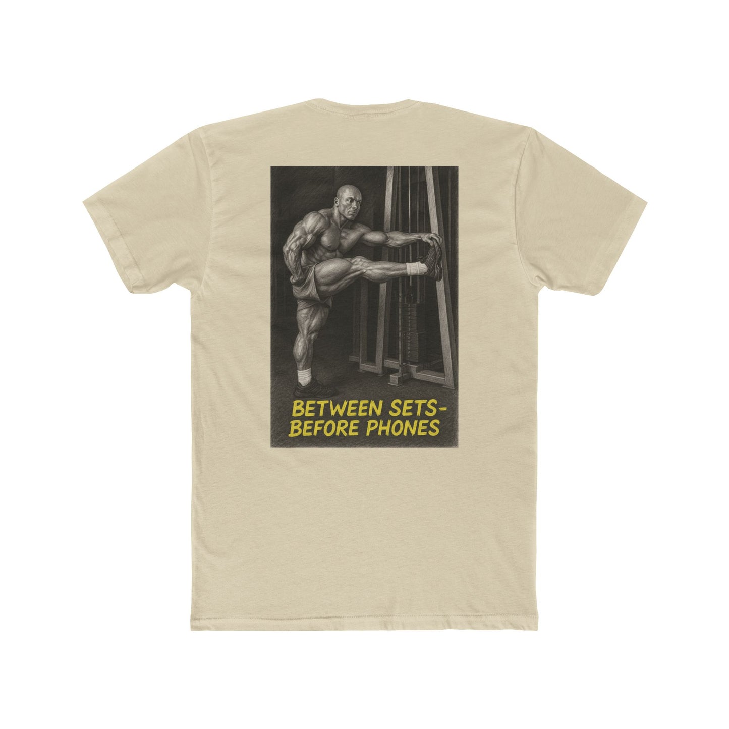 Beige t-shirt with graphic of a muscular man and text 'Between Sets Before Phones' on a white background